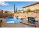 The backyard features a refreshing blue pool, landscaping, and outdoor seating at 5932 Lamotte Ave, Las Vegas, NV 89141