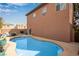 This backyard features a sparkling blue pool and outdoor seating, perfect for relaxation at 5932 Lamotte Ave, Las Vegas, NV 89141