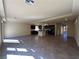 Spacious living area with tile flooring, recessed lighting, and a view into the kitchen at 6093 Crown Palms Ave, Las Vegas, NV 89139