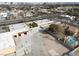 Aerial view displaying property with pool and a city view in the distance at 6130 Tara Ave, Las Vegas, NV 89146