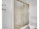 Bathroom with a shower stall, neutral tile, and toilet at 6130 Tara Ave, Las Vegas, NV 89146