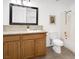 Well-lit bathroom featuring a single sink vanity, toilet, and tub with shower at 6130 Tara Ave, Las Vegas, NV 89146