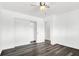 A minimalist bedroom with hardwood floors and closet at 6130 Tara Ave, Las Vegas, NV 89146