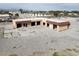 Aerial view showcases a multi-bay commercial building with ample parking and accessibility at 6130 Tara Ave, Las Vegas, NV 89146