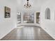 Bright dining area with tile flooring, chandelier, and bay windows create an inviting space for meals at 6130 Tara Ave, Las Vegas, NV 89146