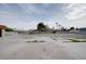Exterior shot showing a large parking area ready for landscaping or business usage at 6130 Tara Ave, Las Vegas, NV 89146
