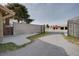 Exterior shot showing secure gated property offering privacy and access to multiple structures at 6130 Tara Ave, Las Vegas, NV 89146