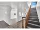 Foyer with wood railing staircase and tile floors, connecting entry to upper level at 6130 Tara Ave, Las Vegas, NV 89146