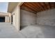 A spacious, unfinished garage space with block walls and an exposed wood ceiling offers potential for customization at 6130 Tara Ave, Las Vegas, NV 89146