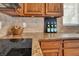 The kitchen displays granite countertops, diamond backsplash, and natural wood cabinetry at 6130 Tara Ave, Las Vegas, NV 89146
