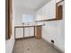 Functional laundry room with ample counter space and storage cabinets at 6130 Tara Ave, Las Vegas, NV 89146