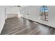 Spacious living room with hardwood floors, natural lighting, and arched windows at 6130 Tara Ave, Las Vegas, NV 89146