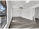 Bright living room featuring hardwood floors, a ceiling fan, and lots of natural light at 6130 Tara Ave, Las Vegas, NV 89146