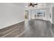 Spacious living room with hardwood floors, a ceiling fan, and a sliding door that lets in natural light at 6130 Tara Ave, Las Vegas, NV 89146