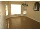 Sunlit living room with neutral walls, tile flooring, and large windows for natural light at 6130 Tara Ave, Las Vegas, NV 89146