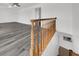 A wooden staircase leads to an open living space with hardwood floors at 6130 Tara Ave, Las Vegas, NV 89146