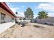 Backyard with large area, palm trees, and high wall for security at 6325 Miraloma St, Las Vegas, NV 89108