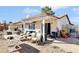 Outdoor backyard with patio furniture and shaded area for outdoor entertainment and relaxation at 6325 Miraloma St, Las Vegas, NV 89108