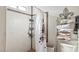 Cozy bathroom featuring tiled walls, a shower curtain, and towel rack at 6325 Miraloma St, Las Vegas, NV 89108