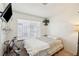 Cozy bedroom featuring a large window and a comfortable bed at 6325 Miraloma St, Las Vegas, NV 89108