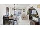 The dining room has tile flooring, natural lighting, and plenty of space for entertaining at 6325 Miraloma St, Las Vegas, NV 89108