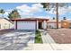 Charming single-story home featuring a two-car garage and low maintenance desert landscaping at 6325 Miraloma St, Las Vegas, NV 89108