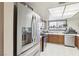 Traditional kitchen with stainless steel appliances and natural light at 6325 Miraloma St, Las Vegas, NV 89108