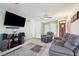 The living room is painted a neutral color and has neutral-toned carpet flooring at 6325 Miraloma St, Las Vegas, NV 89108