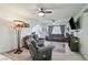 The spacious living room features neutral walls, carpet flooring, and comfortable seating at 6325 Miraloma St, Las Vegas, NV 89108