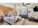 Spacious main bedroom with decorative wood accent wall and four poster bed at 6325 Miraloma St, Las Vegas, NV 89108