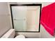 Compact bathroom including a shower-tub with a sliding door and a toilet at 6750 Del Rey Ave # 133, Las Vegas, NV 89146