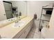 Bathroom featuring a sink and vanity with tile floors and neutral walls at 6750 Del Rey Ave # 133, Las Vegas, NV 89146