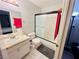 Compact bathroom features a shower-tub with sliding door, toilet, and a modest vanity at 6750 Del Rey Ave # 133, Las Vegas, NV 89146