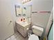 Functional bathroom features a vanity, toilet, and themed decoration on the walls at 6750 Del Rey Ave # 133, Las Vegas, NV 89146