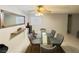 Dining room featuring a modern light fixture, glass table and 6 gray chairs at 6750 Del Rey Ave # 133, Las Vegas, NV 89146