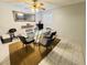 Dining room featuring a modern light fixture, large glass table and 6 chairs at 6750 Del Rey Ave # 133, Las Vegas, NV 89146