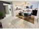 Dining room featuring a modern light fixture, large glass table and 6 chairs at 6750 Del Rey Ave # 133, Las Vegas, NV 89146