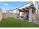 Spacious backyard with manicured lawn, patio area, and privacy fencing; perfect for outdoor living at 6957 Antequera St, Las Vegas, NV 89149