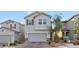 Charming two-story home featuring desert landscaping, a two-car garage, and neutral-toned stucco exterior at 6957 Antequera St, Las Vegas, NV 89149