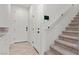 Bright hallway with white walls and carpeted stairs at 6957 Antequera St, Las Vegas, NV 89149