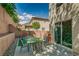 The backyard offers space for outdoor entertaining with a patio, play set, and rock landscaping at 7113 Forest Heights Ct, Las Vegas, NV 89166