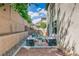 Private backyard with lush landscaping, an outdoor seating area, and a serene, inviting atmosphere at 7113 Forest Heights Ct, Las Vegas, NV 89166