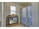 Bathroom featuring a decorative mirror and shower with a blue patterned shower curtain at 7113 Forest Heights Ct, Las Vegas, NV 89166