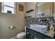 Chic bathroom with mosaic tile accents, vessel sink, and a decorative mirror at 7113 Forest Heights Ct, Las Vegas, NV 89166