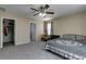 Inviting bedroom with closet and ensuite bath access, furnished with a writing desk at 7113 Forest Heights Ct, Las Vegas, NV 89166