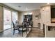 Cozy dining area with a round table, chairs, and sliding glass doors to the backyard at 7113 Forest Heights Ct, Las Vegas, NV 89166