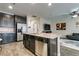 Stylish kitchen features granite countertops, stainless steel appliances, and an island with a sink and dishwasher at 7113 Forest Heights Ct, Las Vegas, NV 89166