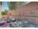 Serene backyard patio featuring stylish outdoor furniture, a cozy fire pit, and privacy walls at 7113 Forest Heights Ct, Las Vegas, NV 89166