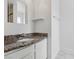 Bathroom featuring granite countertop, a vessel sink, and modern fixtures at 7200 Pirates Cove Rd # 2089, Las Vegas, NV 89145
