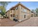 Beige two-story condo building shows a well-maintained exterior with classic architectural details and landscaping at 7200 Pirates Cove Rd # 2089, Las Vegas, NV 89145